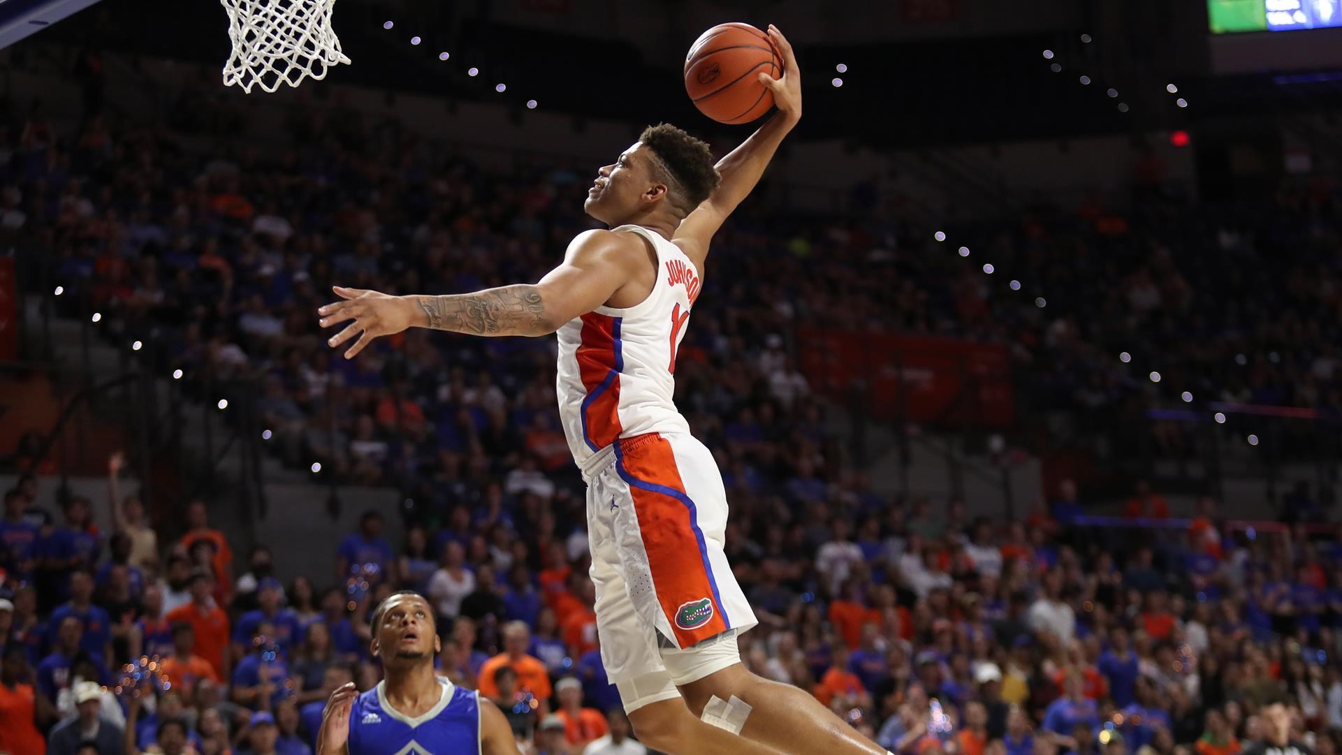 Florida basketball forward Keyontae Johnson dunks a basketball in game in the SEC