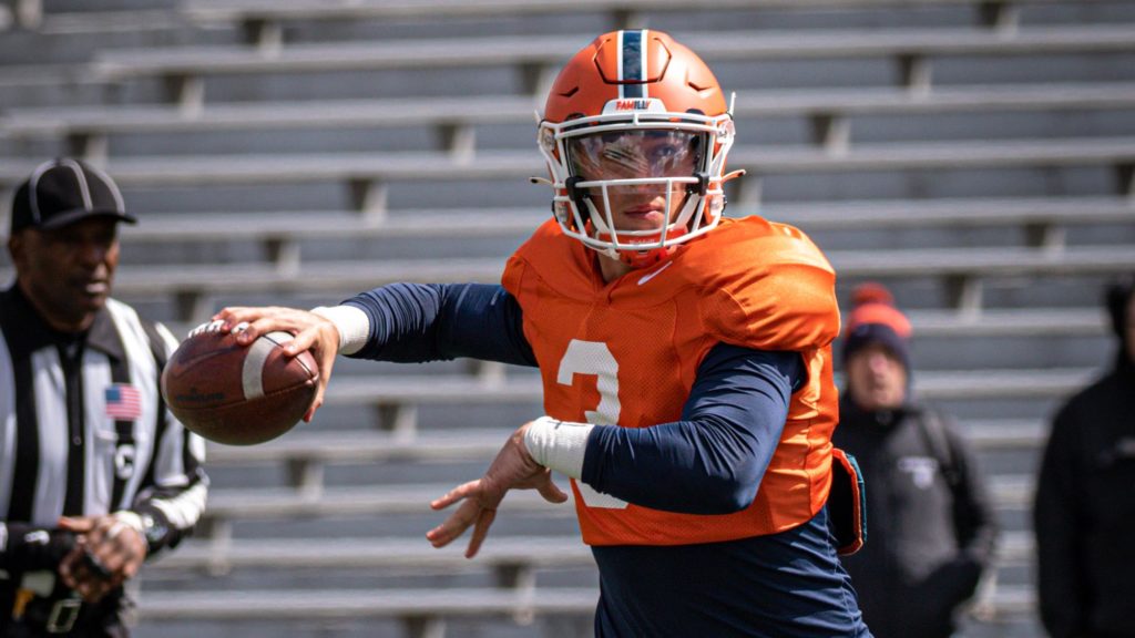 Illinois football quarterback Tommy Devito throws a pass.