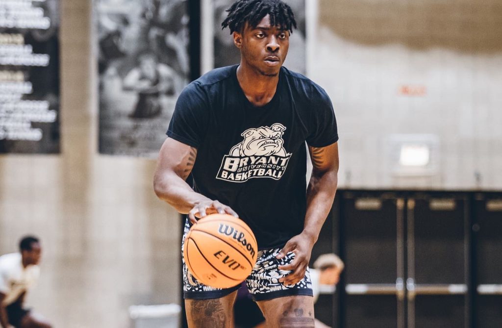 Earl Timberlake Bryant basketball dribbles a basketball.