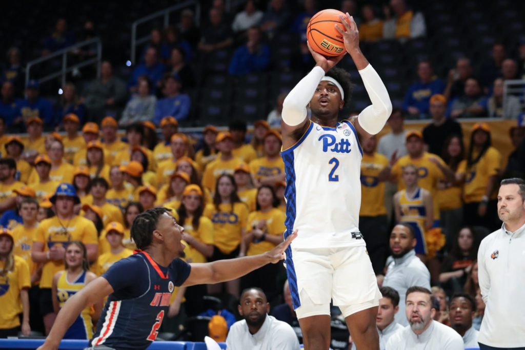 Pitt's Blake Hinson shoots a three.